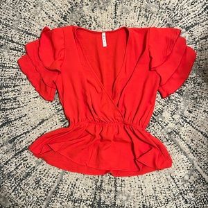 Red low-cut Ruffled top with elastic waistband. Size small. Very flattering!